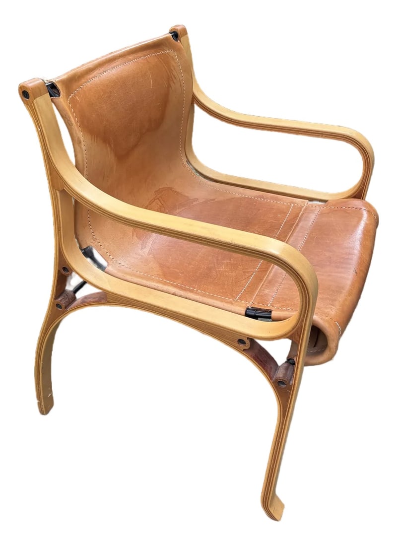Cristian Valdez Leather Desk Chair: The chair is composed of a cold-drawn steel frame, a natural vegetable-tanned cowhide cover, and laminated beech and elm wood ribs, with steamed oak inserts. Condition: Alterations: Original Condition