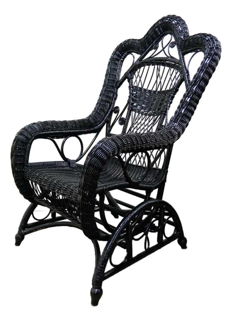 Victorian Wicker Spring Rocking Chair in Black: A Victorian style wicker spring rocking chair painted in semi-gloss black. Unmarked but possibly Heywood Wakefield. Condition: Alterations: Original Design Modified Imperfections: Some Imperfections C