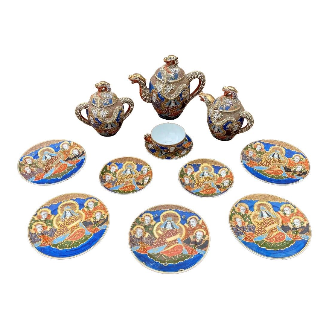 Vintage Mid-Century Modern Japanese Imari Tea Set- 11 Pieces: Beautiful vintage MCM Japanese Imari tea set. Tea set is blue, brown, orange, gold. Tea pot, creamer and sugar are shaped like dragons and plates and cup depict warriors. Set is not complete. Set incl