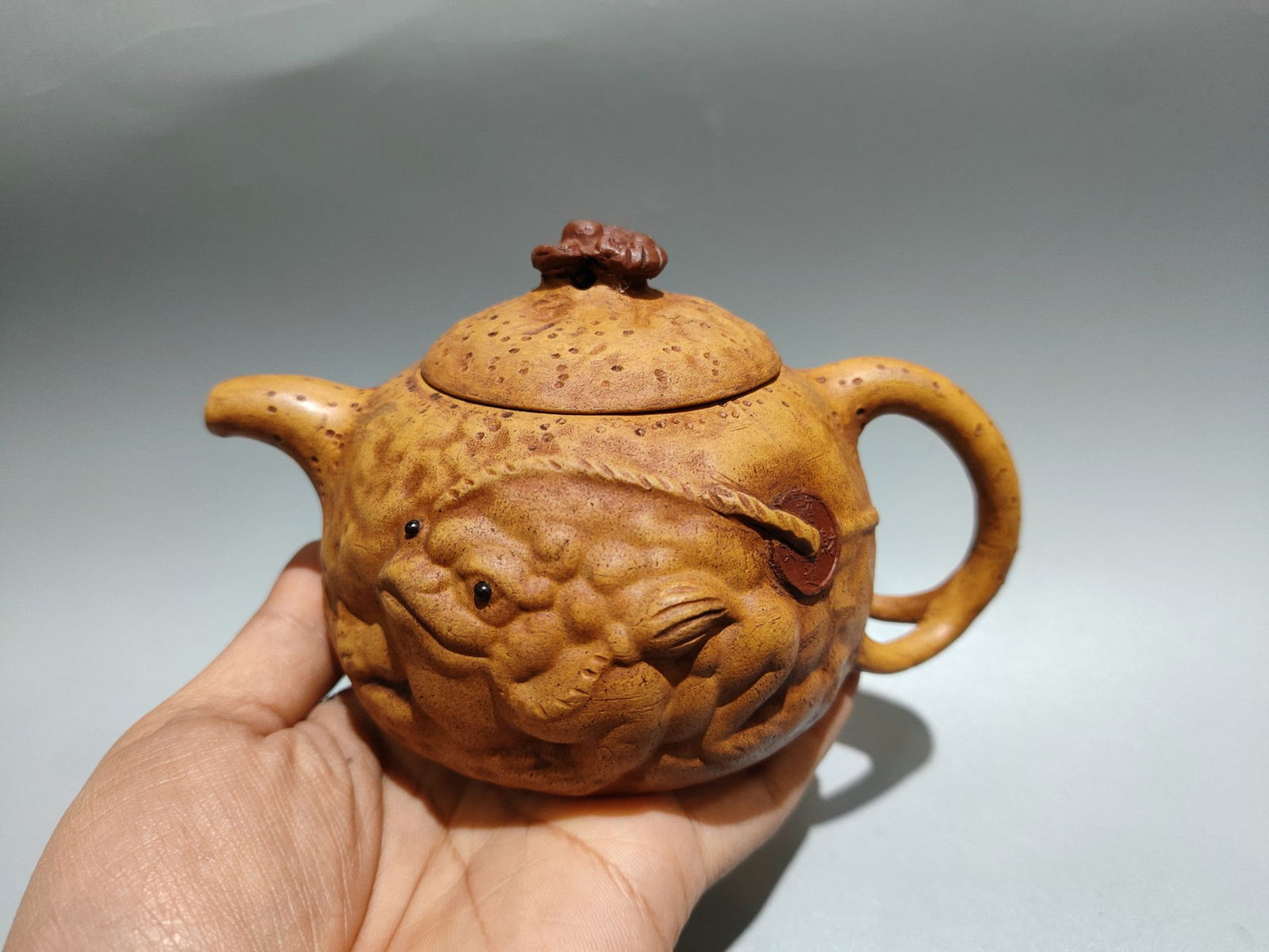 Chinese Yellow Yixing Zisha Clay Fortune Toad Teapot: Title: Chinese Yellow Yixing Zisha Clay Fortune Toad Teapot Origin: Chinese Date/Period: Materials: Yixing Zisha Dimensions: 150x90(mm) 5.91x3.54(inches) Reserve: $199.00 Shipping: Domestic: S