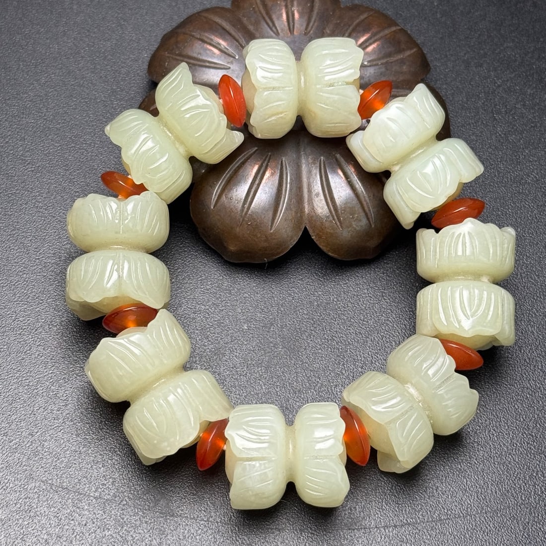 Hand Woven Chinese Hetian Jade Beads Bracelet: Title: Hand Woven Chinese Hetian Jade Beads Bracelet Origin: Chinese Date/Period: After2000 Materials: Hetian Jade Dimensions: 17 x 21 (mm) 0.67 x 0.83 (inches) Weight: 0.21 lbs/ 94 g Reserve: $286.00