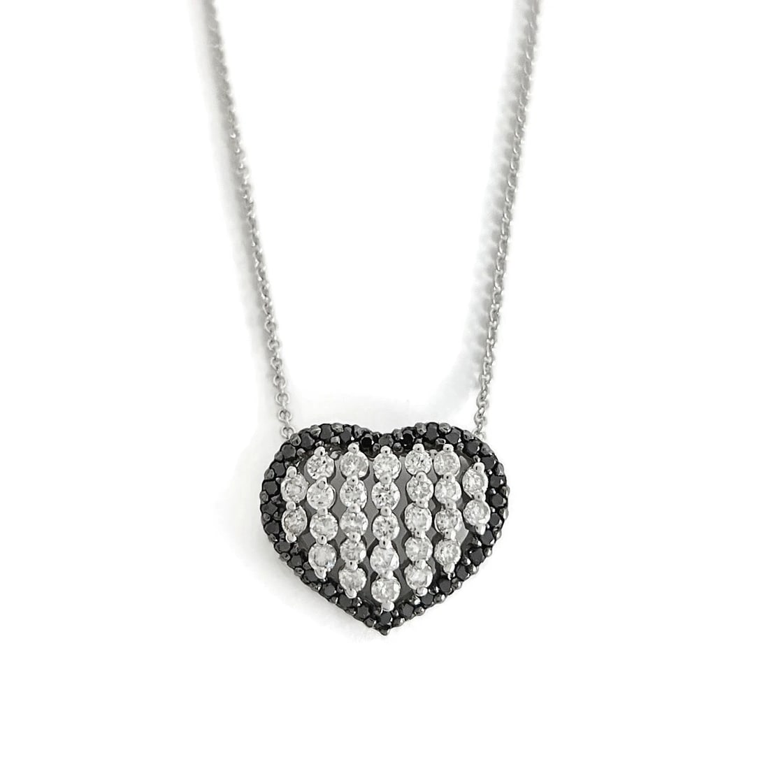 Italian Pave Black White Diamond Heart Pendant Necklace 14K White Gold, .71 CTW: Italian Pave Black White Diamond Heart Pendant Necklace 14K White Gold, .71 CTW This is a beautiful necklace. Please let us know if you have any questions :) Diamonds: .85 ctw; 27 round brilliant cuts