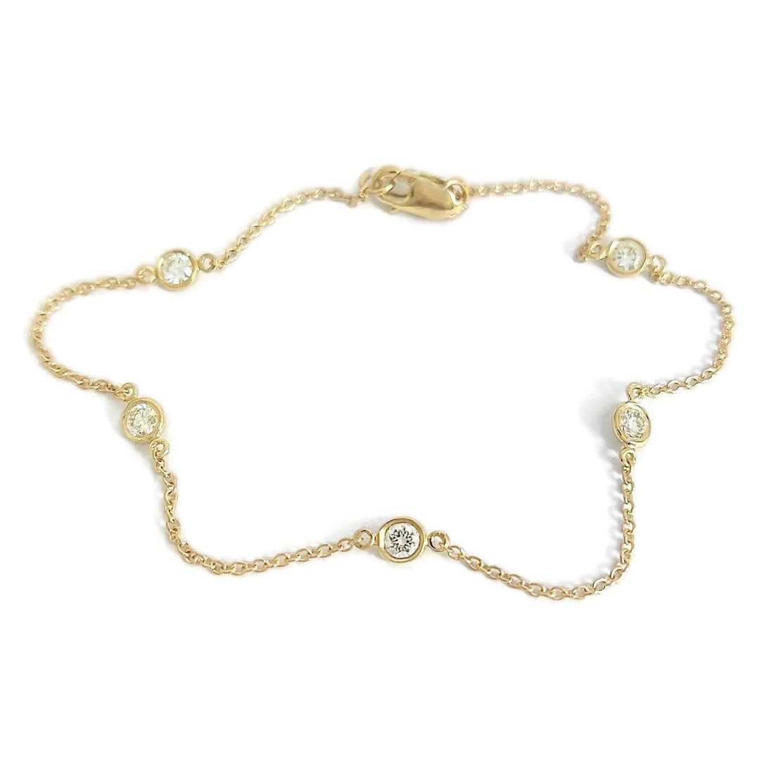 Round Diamond Bezel Station Chain Bracelet 14K Yellow Gold, .40 CTW: Round Diamond Bezel Station Chain Bracelet 14K Yellow Gold, .40 CTW This is such a lovely bracelet! Please let us know if you have any questions. Diamonds: 5 round brilliant cuts, .40 ctw, J-K, VS2-SI