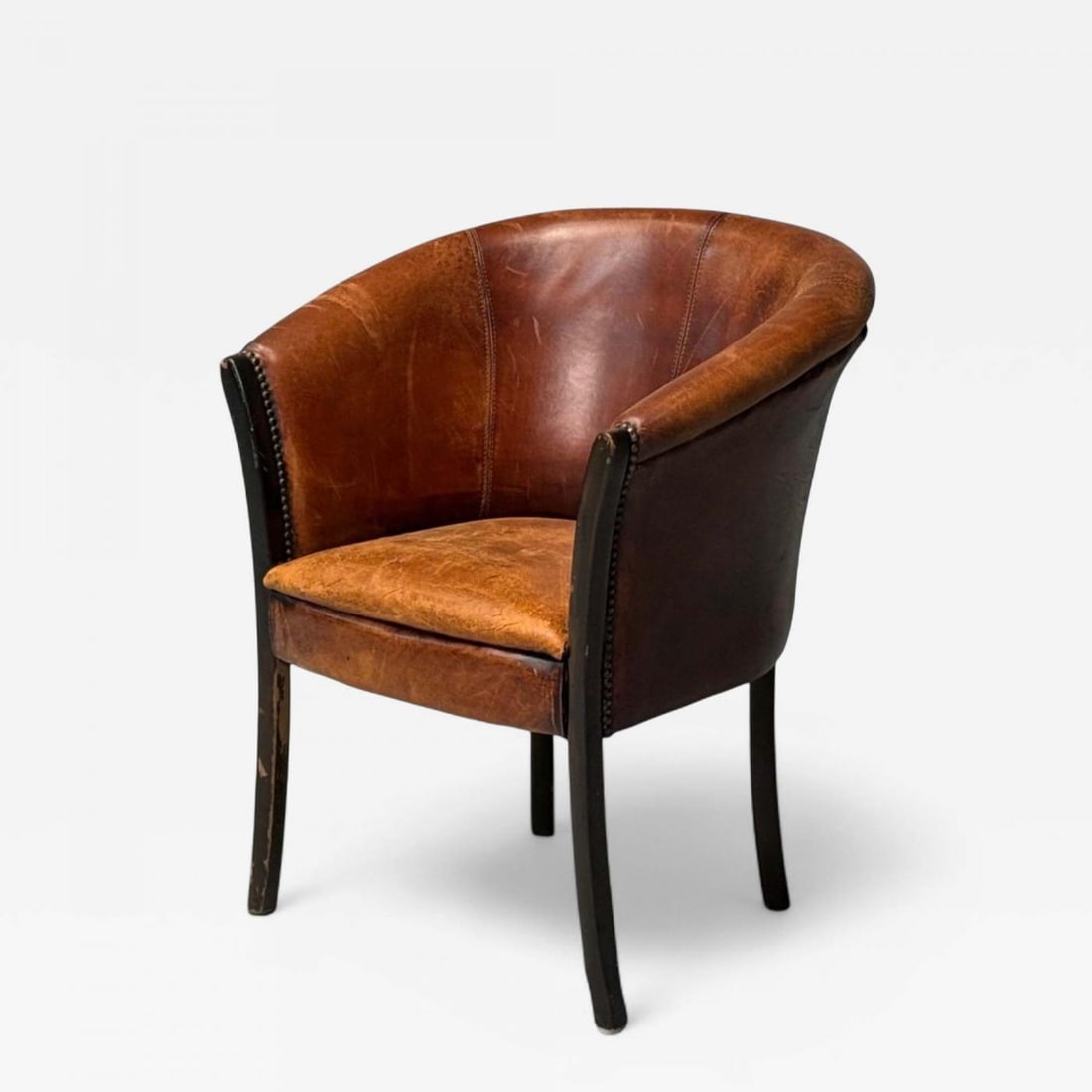 Georgian Style, Distressed Brown Leather, Stained Wood, Tub Chair, USA, 1960s: Georgian Style, Distressed Brown Leather, Stained Wood, Arm or Occasional Chair, USA, 1960s A tub chair after Edwardian period pieces in brown heavily distressed leather and an equally distressed stai