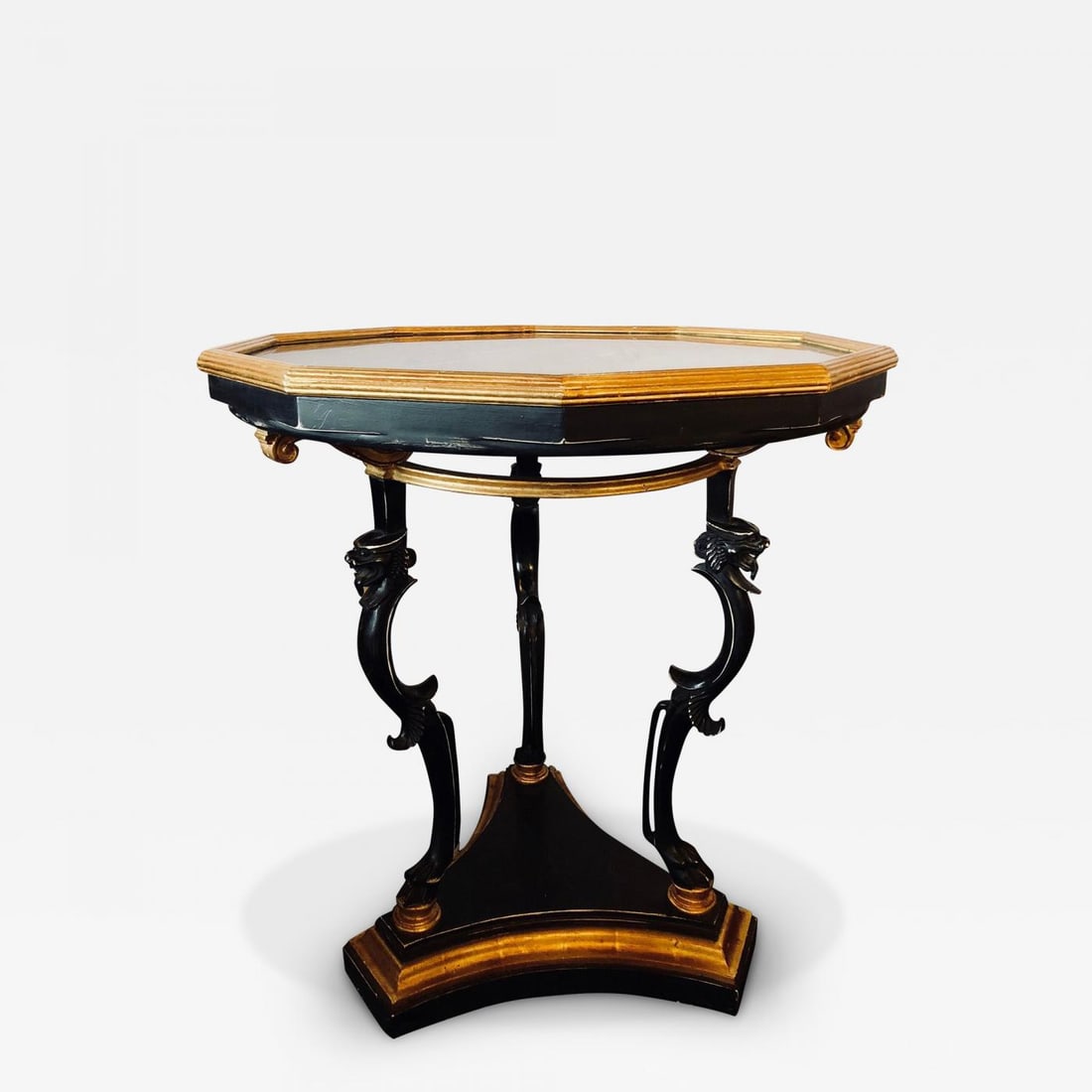 Ebony and Gilt Marble Top Octagonal Shaped Centre or End Table or Pedestal: An ebony and gilt marble-top octagonal shaped centre or end table or pedestal. The tripod gilt bordered ebony base supporting a set of three carved ebony legs each starting with a claw foot and termin
