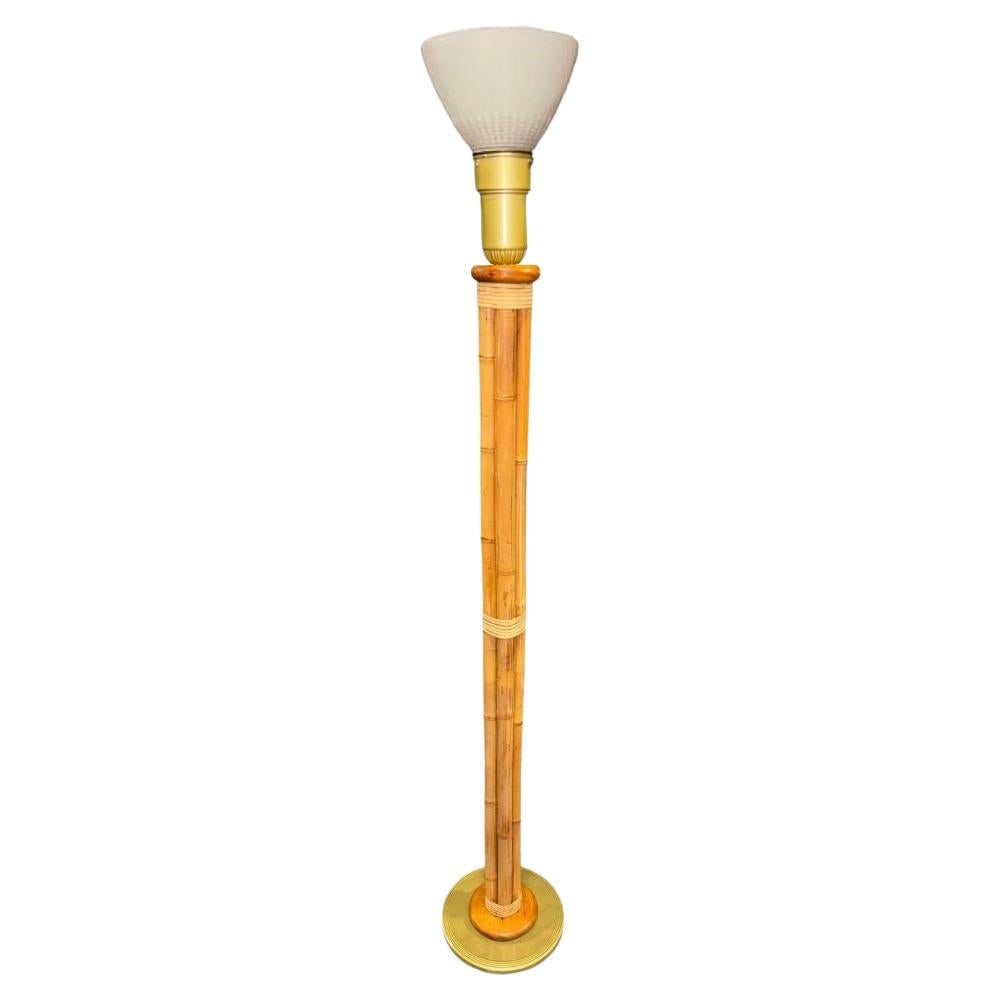 Mid-Century 4 Strand Rattan & Wicker Floor Lamp w/ Brass Base: This beautifully restored Paul Frankl-inspired pole rattan lamp features four rattan poles bound together with wicker wraps mounted to a brass lamp base. The lamp is topped with a large brass light so