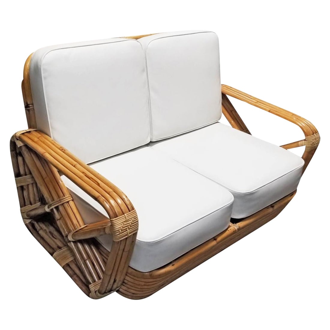 Paul T. Frankl 4-Strand Square Pretzel Round-Back Settee: This rare, museum-quality four-strand square pretzel round-back settee was designed by Paul T. Frankl using the highest-quality rattan poles and reeds available and restored by rattan experts to
