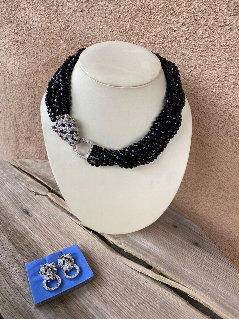 Vintage KJL Nina Ricci Rhinestone Leopard Necklace & Earrings Set: Necklace + 1 pr of earrings. Leopard clasp. Faceted black glass beads, 8 strands, Pave rhinestones, Doorknocker earrings. Also leopard. Both cats have green eyes. Clips good on earrings. Mid 1980s Mea
