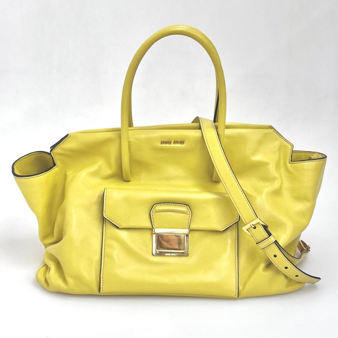 MIU MIU Yellow Leather Shoulder Shopper Bag: Title: MIU MIU Yellow Leather Shoulder Shopper BagMaterial:LeatherDimensions: • Length: 40x49 cm• Height: 25 cm• Width: 20 cmDescription:(6162B300). Miu Miu Yellow Leather Shopper