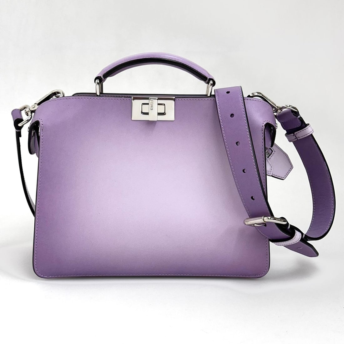 FENDI Peekaboo Regular in Lilac Gradient Leather with Silver Trim: Title: FENDI Peekaboo Regular in Lilac Gradient Leather with Silver Trim Material:Leather Dimensions: • Length: 26 cm• Height: 20 cm• Width: 9 cm Description:(6191B760). A bag that e