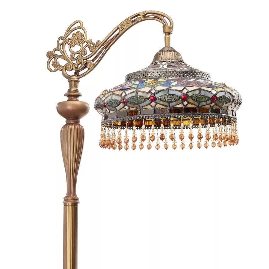 French Stained Glass Reading Floor Lamp: This Tiffany-style floor lamp carries a distinctly European elegance, recalling the romantic glow of late-19th-century Parisian interiors. The mosaic glass shade, composed of softly muted jewel tones,