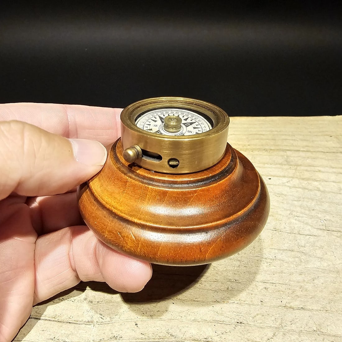 Turned Mahagony Wood and Brass Compass: 2 3/4" Wide x 1 1/4" Tall Reserve: $20.00 Shipping:Domestic: Flat-rate of $13.00 to anywhere within the contiguous U.S.International: Foreign shipping rates are determined by