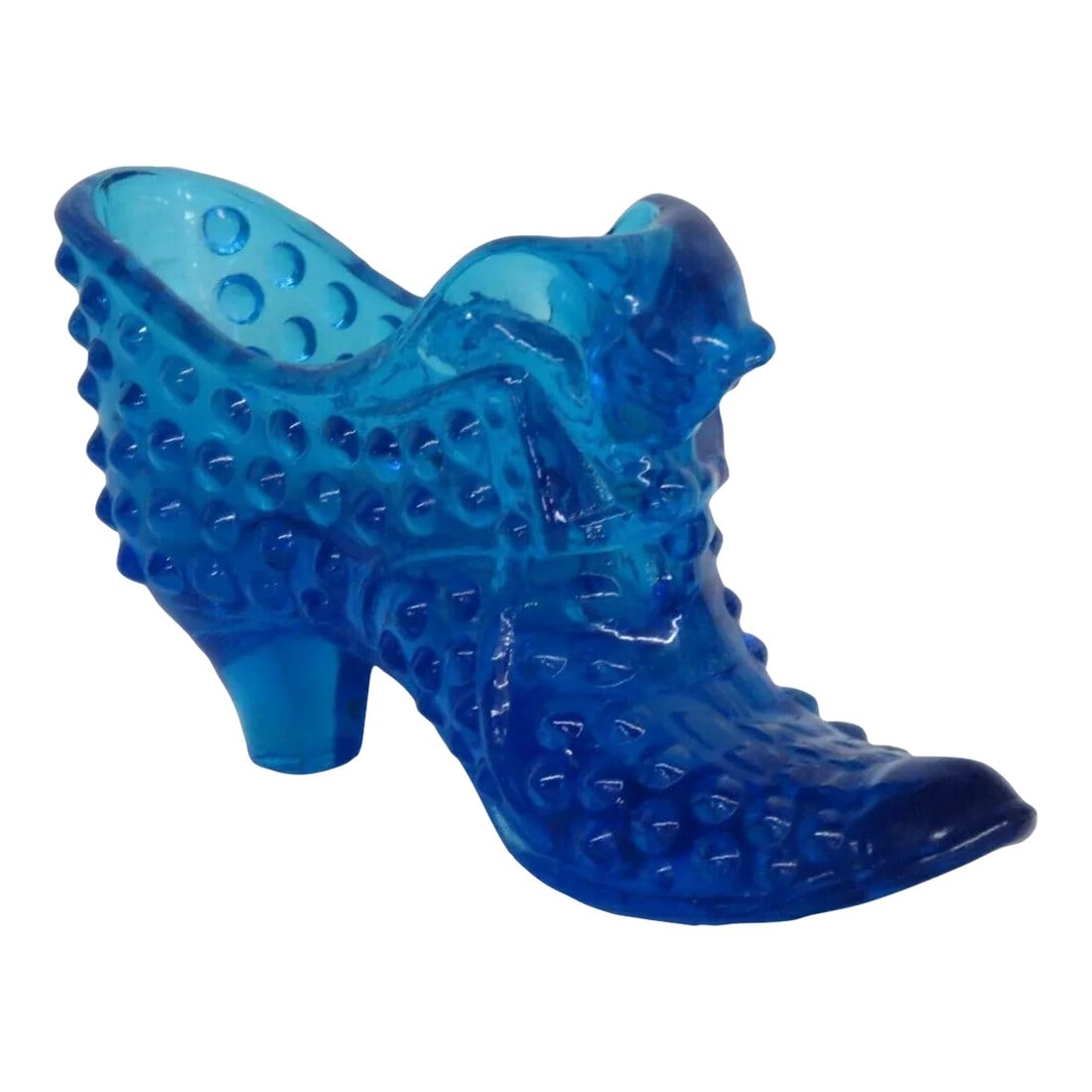 Fenton Blue Hobnail Cat Head Victorian Glass Slipper Shoe Figurine: This gorgeous figurine is made out of glass. This wonderful piece is a depiction of a Victorian style shoe in a marvelous blue color, with an interesting design of a cat head to the top of the shoe