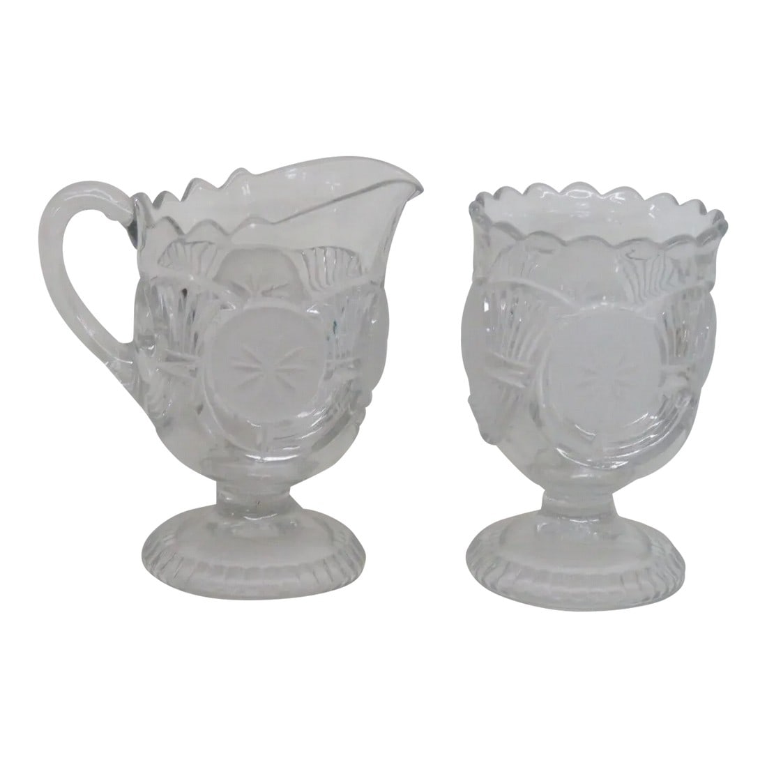 Eapg Glass Horn of Plenty Frosted Circle Footed Creamer and Sugar Bowl Set: This wonderful Set of a footed Creamer and Sugar Bowl is made of glass. This Set appears to be Early American Pattern Glass (EAPG) pieces, both pieces are made in a gorgeous clear color and are made i