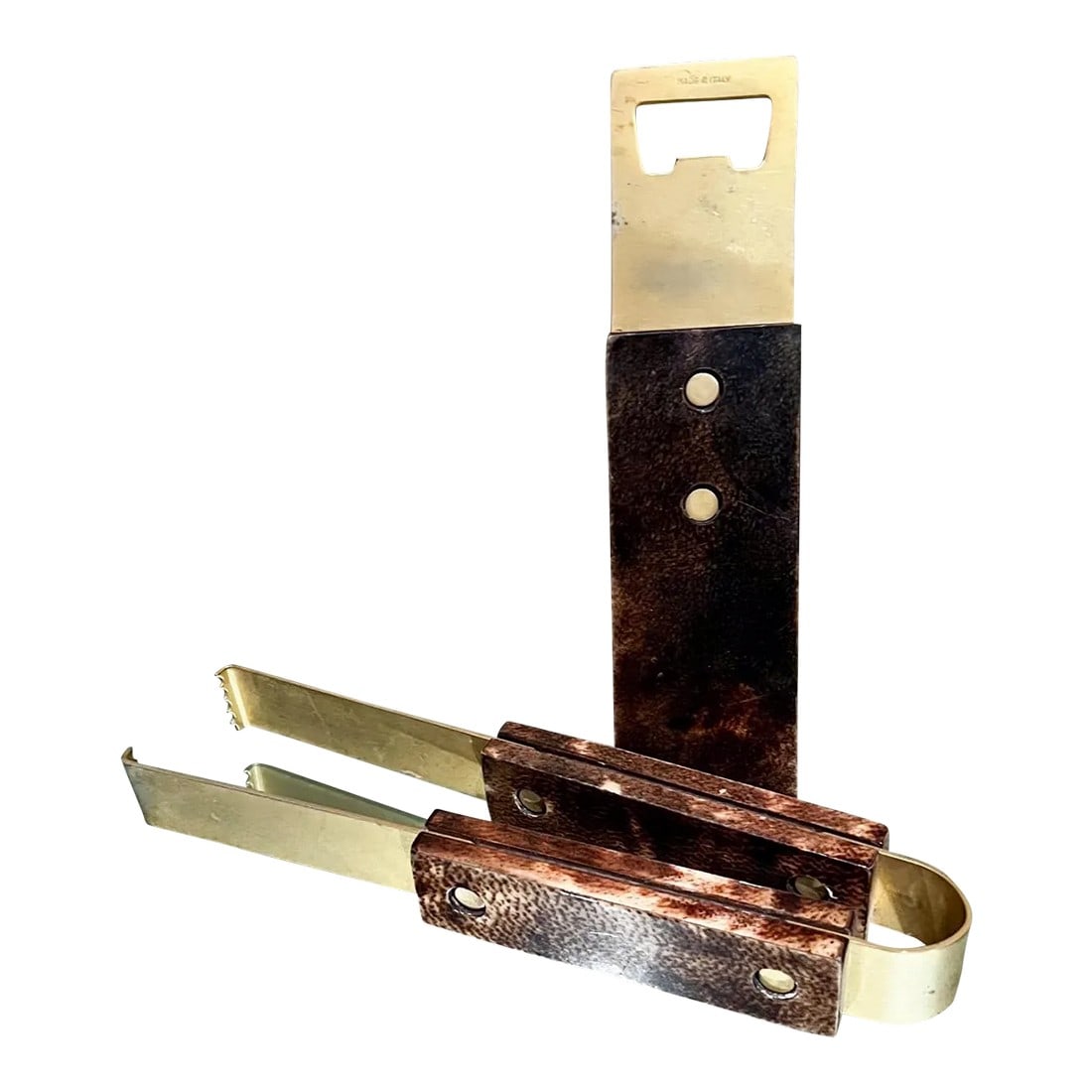 Aldo Tura Barware Bottle Opener + Ice Tongs Goatskin and Brass Italy: AMBIANIC presents Aldo Tura Barware Set: Bottle Opener 8.88 L x 2.25 W x .75 inches and Ice Tongs 10.5 L x 2.63 W x 1.25 D inches Stamped Made in Italy. Unmarked. Brown Goatskin with Brass plated