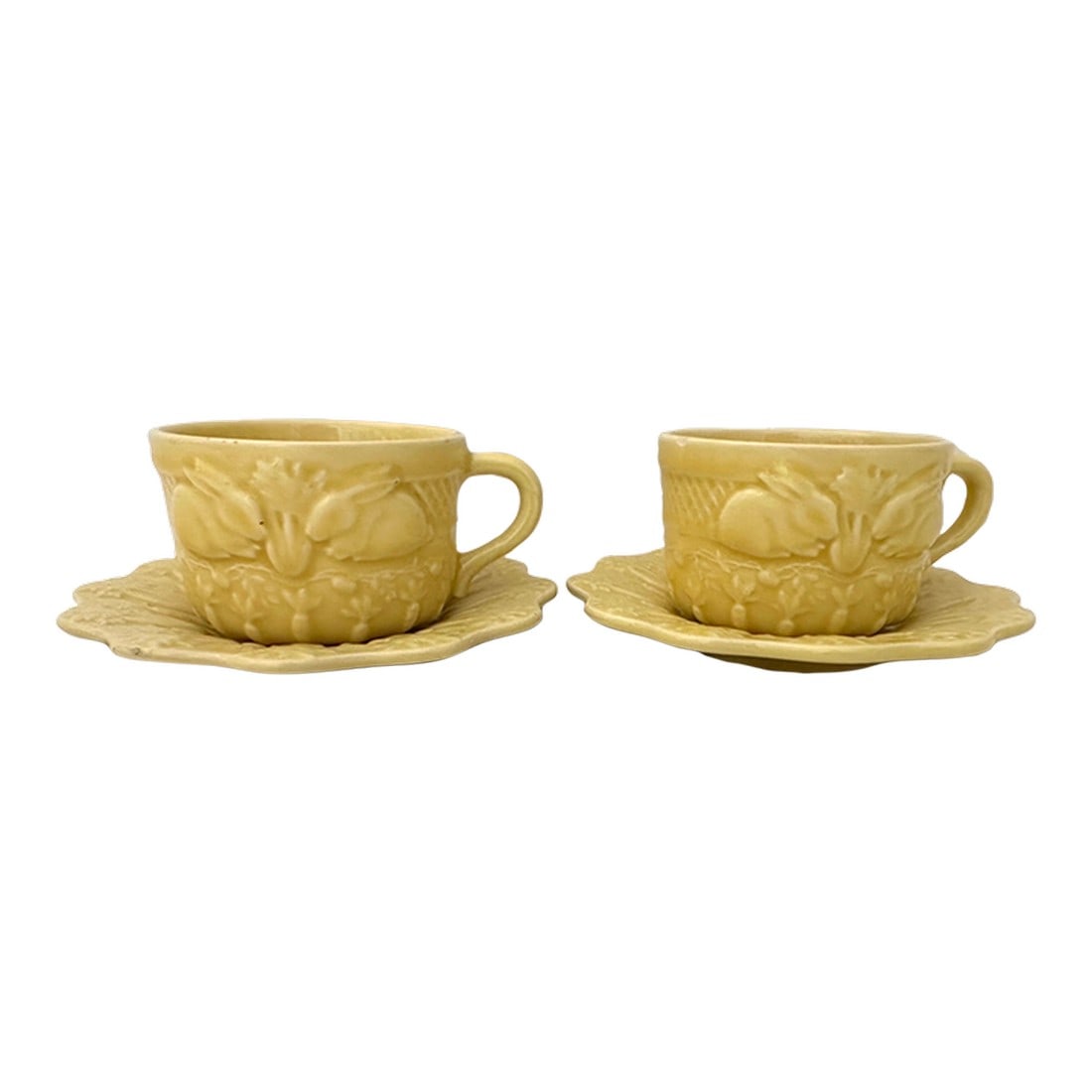 Vintage Pair of Bordallo Pinheiro "Rabbit" Yellow Flat Cup/Saucer: Vintage Pair of Bordallo Pinheiro "Rabbit" Yellow Flat Cup/Saucer. Cups have bunnies and carrots raised relief print. Saucer has carrots and cabbage raised relief. Plates-6in diameter Cups-2.5in h x 4