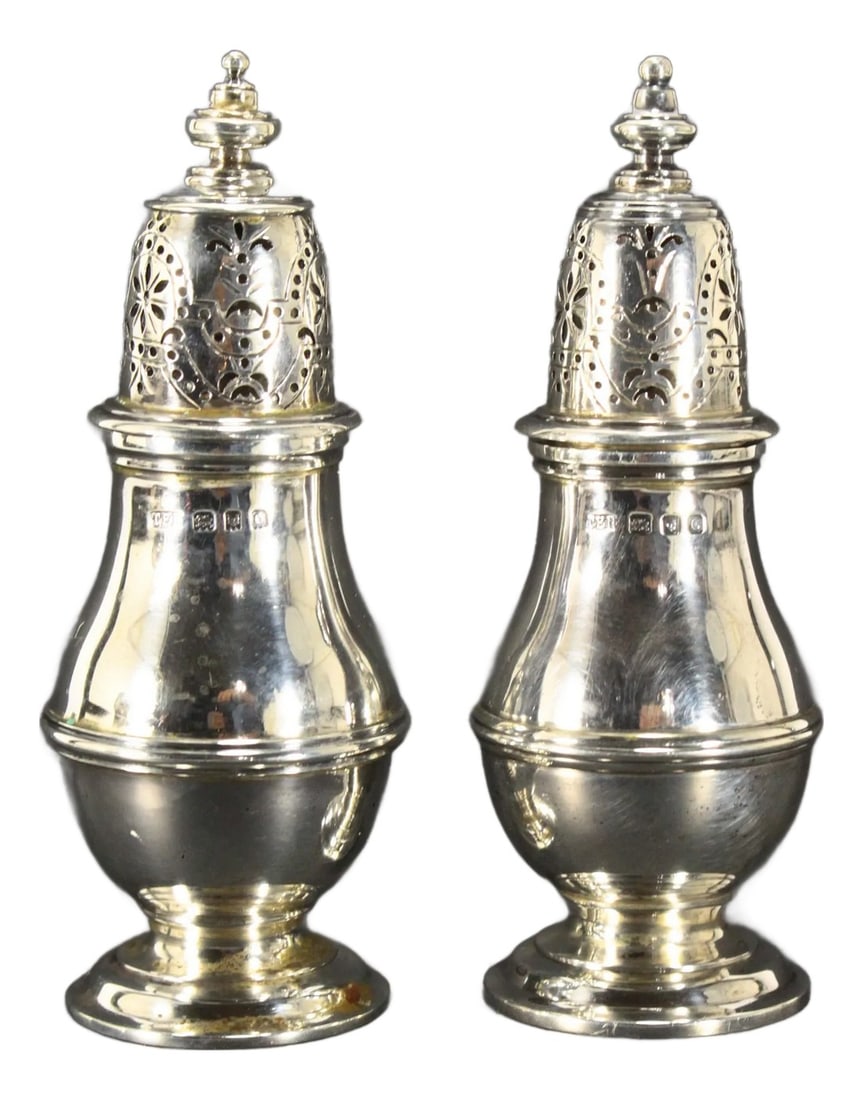 1929-1938 London Pair of Sterling Silver Casters Muffineers, Thomas Edward Rawlings, Maker: A great pair of casters, muffineers or salt & paper shakers Shapely baluster form on raised foot with domed lids, perforated with open work designs Solid sterling silver with full set of marks; the 3