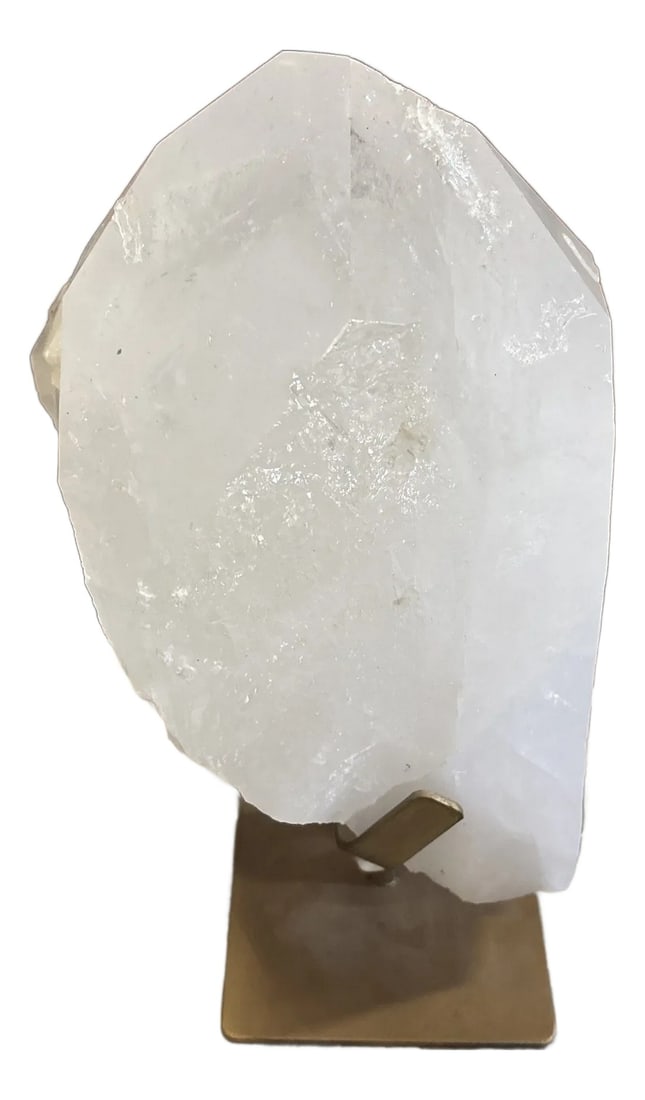 A Quartz Crystal on Golden Stand - H: A natural quartz crystal from Uruguay that is presented on a custom gold toned metal stand. Quartz crystals have been valued throughout history, by nearly every civilization, for their healing and spi