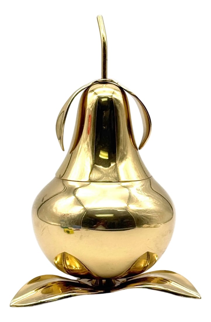 1970s Italian Brass Pear Form Lidded Table Box on Leaf Base: 1970s Italian Brass Pear Form Lidded Table Box on Leaf Base A bold and playful 1970s Italian sculptural box in the form of a stylized pear, crafted in polished brass and resting on a naturalistic leaf