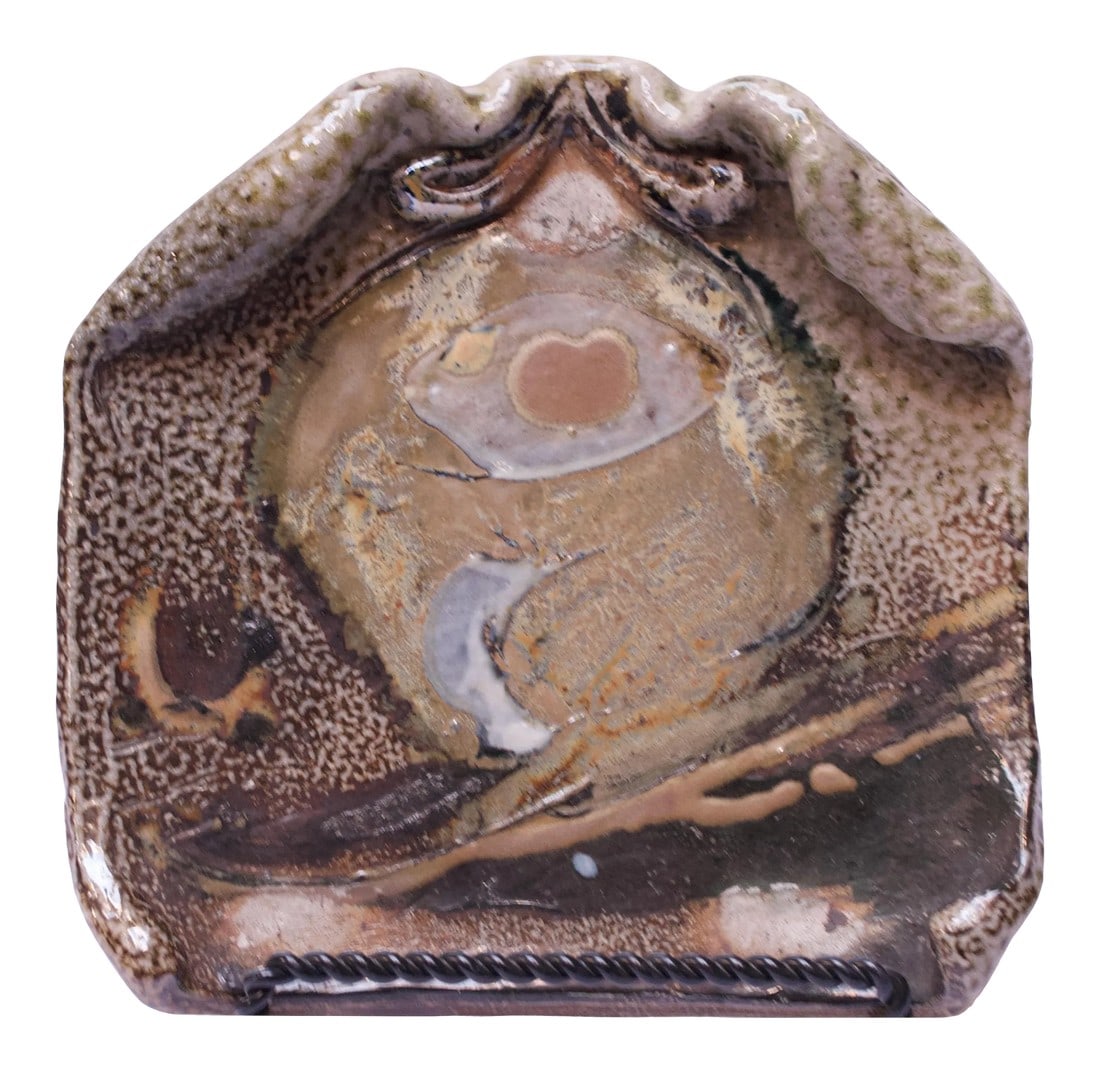 1973 Pollack Stoneware Slab / Decorative Plate: Stoneware slab / decorative plate with of an attractive palette of earth tones with pops of pink for contrast and a mottled decorative border. Signed "Pollack '73.". Height: 1.5 in. x Width: 8.25