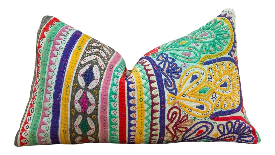 Kra Antique Tribal Grain Sack Pillow: These colorful throw pillows are made from Rabari tribal dowry bags. The embroidery is on cotton and has intricate chain stitch of embellished patterns, motifs of flowers, peacocks and other tribal de