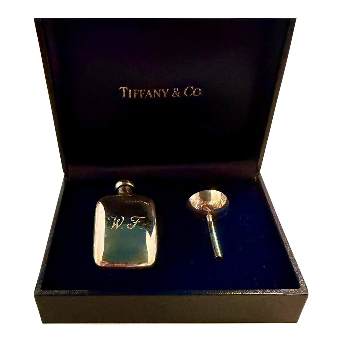 Tiffany & Co. Miniature Sterling Silver Traveling Perfume Flask and Funnel Set, Monogrammed W. F.: Tiffany & Co. sterling silver perfume flask and funnel set with navy blue silk carrying bag and fitted presentation box for storage. The miniature size of the flask and funnel makes it perfect for