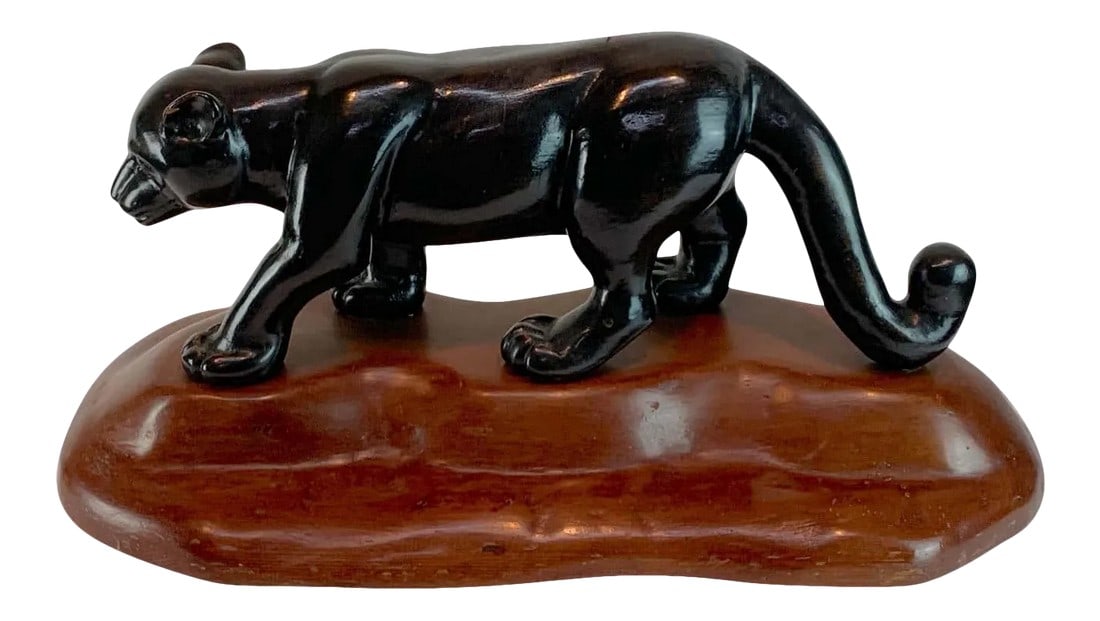 Mid 20th Century French Modern Carved Wood Sculpture of Black Panther/ Jaguar: French modern carved wood sculpture of black panther/ jaguar, well carved ebonized walking black panther/ jaguar on a natural rockwork base. The base measures 22.75 x 11" deep The black panther/ jagua