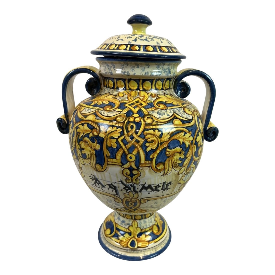 1990s Italian Hand-Painted Blue Urn With Scrolled Handles: Hand painted blue urn with scrolled handles featuring a delicate design in shades of blue and yellow. Hand made items may vary in size, pattern and color. Italy. Condition: Alterations: Original
