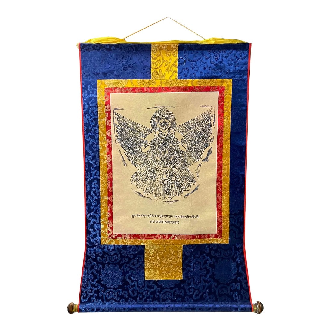 Tibetan Print Fabric Trim Guardian Buddha Deity Art Wall Scroll Thangka: This is a Tibetan Thangka that has a print graphic of Tibetan Buddha or Deity Art at the center and is surrounded by colorful fabric. It is in a scroll style for easy storage and display. Dimensions: