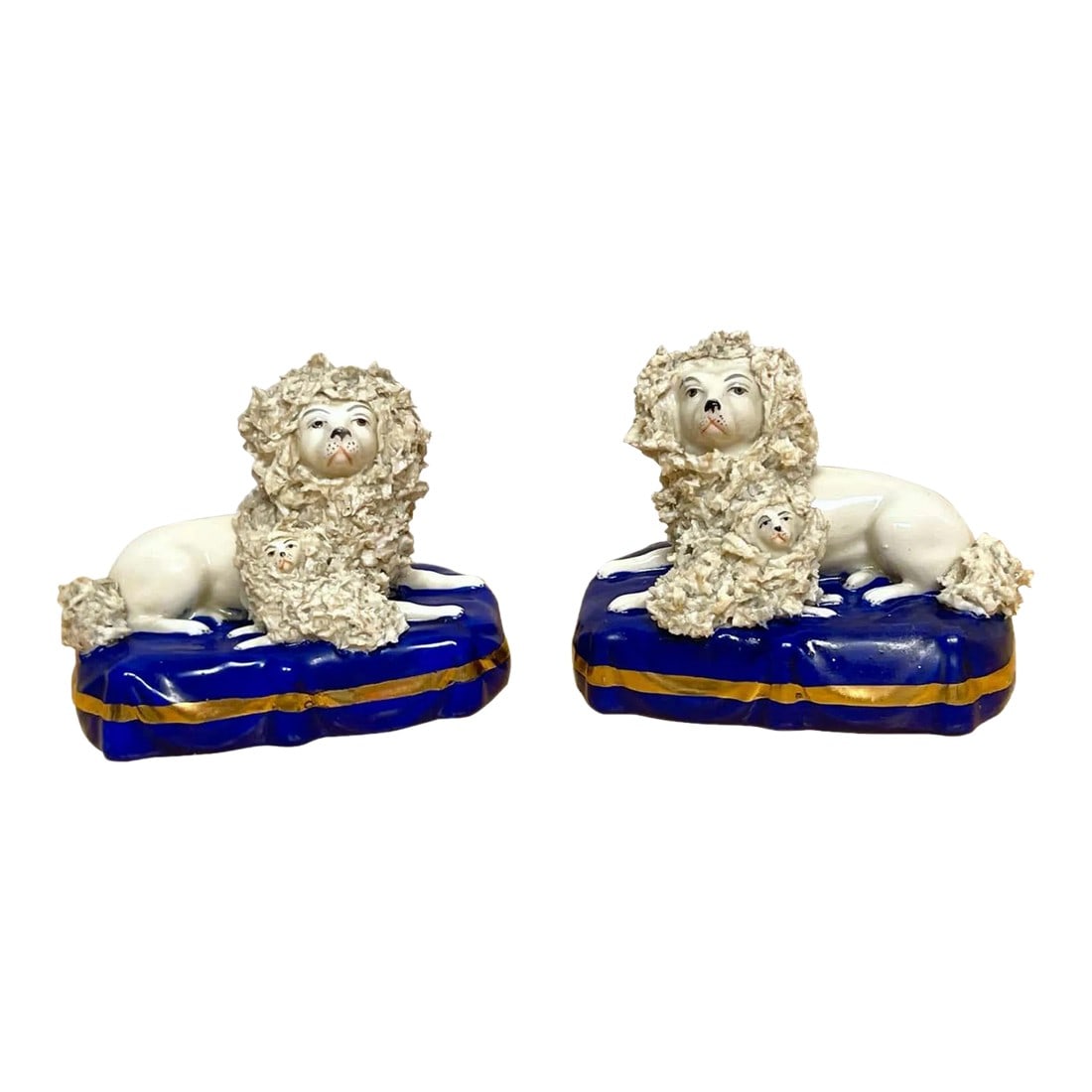 19th Century Chelsea Porcelain Figures of Seated Poodles & Pups - A Pair: Pair of 19th century Chelsea Porcelain figures of seated poodles & pups England, Circa 1850s A rare find, a true pair of Chelsea Porcelain (Attributed) poodles and pups. Both figures well painted, wit