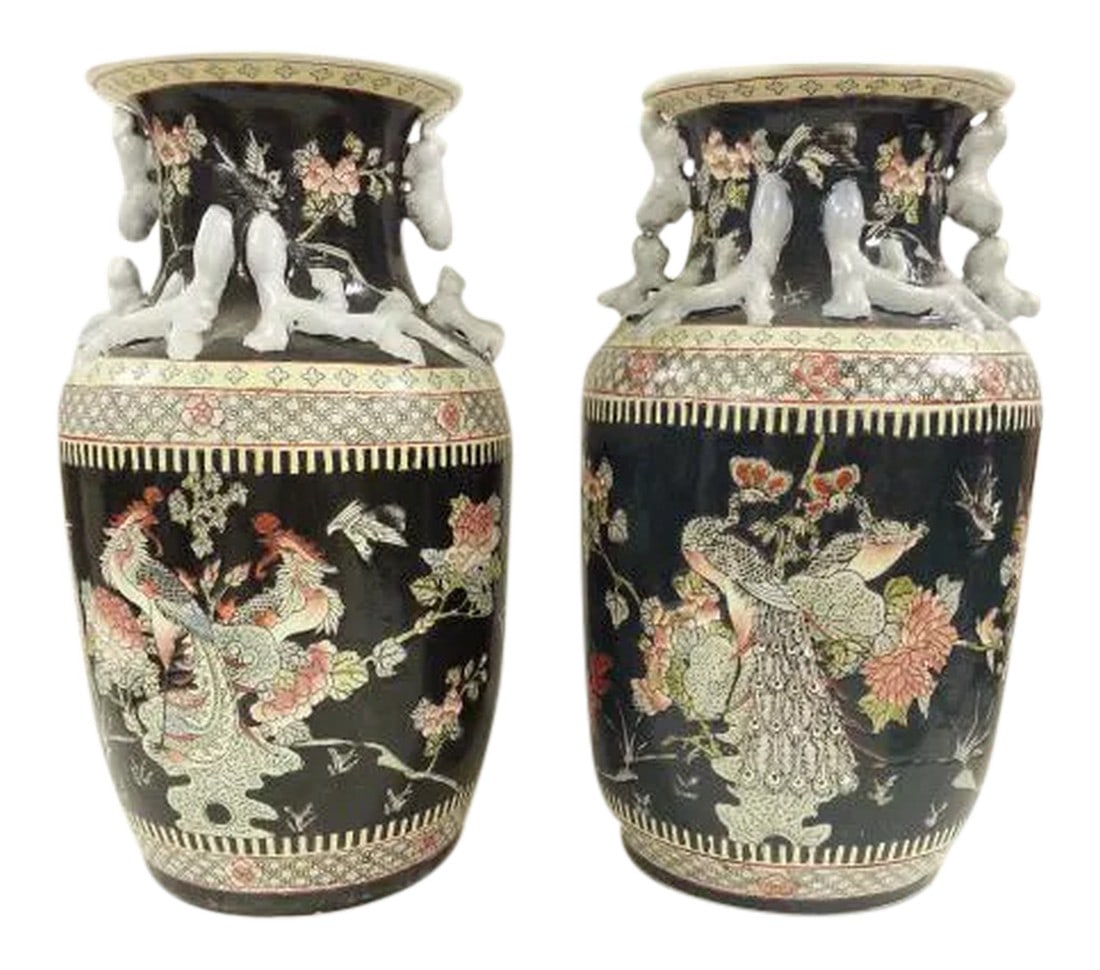 Pair of Chinese Vintage Peacock Black Porcelain Vases: Chinese Vintage Peacock Black Porcelain vase . Design with floral, leave in a harmony wave. Fu dog handles with other small lions around. crisis cross design in style of tassels represent prosperity ,