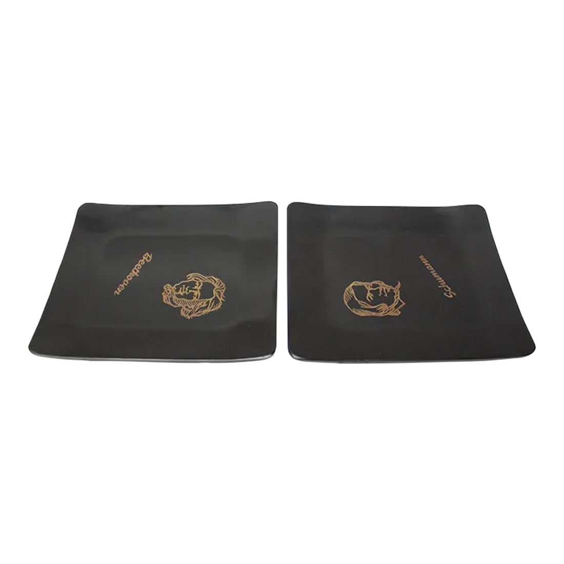 Set of Two Small Mid-Century Black Resin Inlaid "Beethoven and Schumann" Composer Trays by Couroc: Set of two small 1960s "Classical Music Composer" figurative trays/hors d'oeuvre plates/ashtrays by Couroc of Monterey, California depicting Robert Schumann and Ludvig van Beethoven, respectively. 