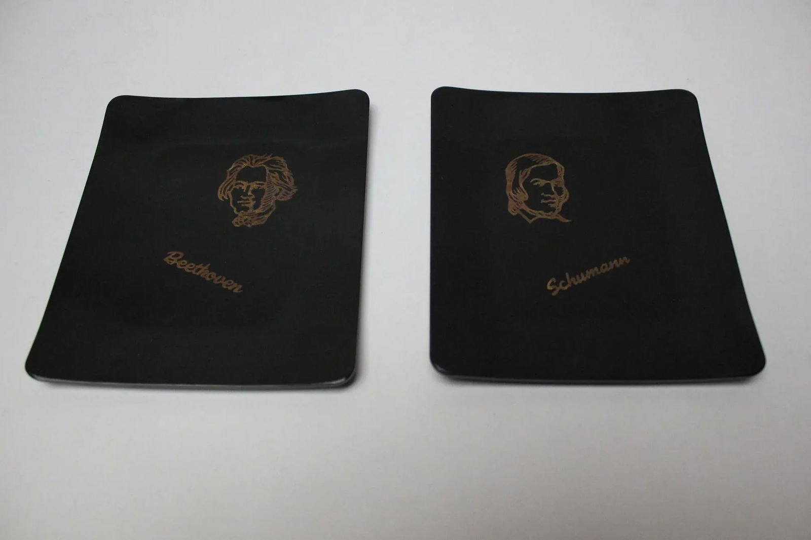 Set of Two Small Mid-Century Black Resin Inlaid "Beethoven and Schumann" Composer Trays by Couroc - 2