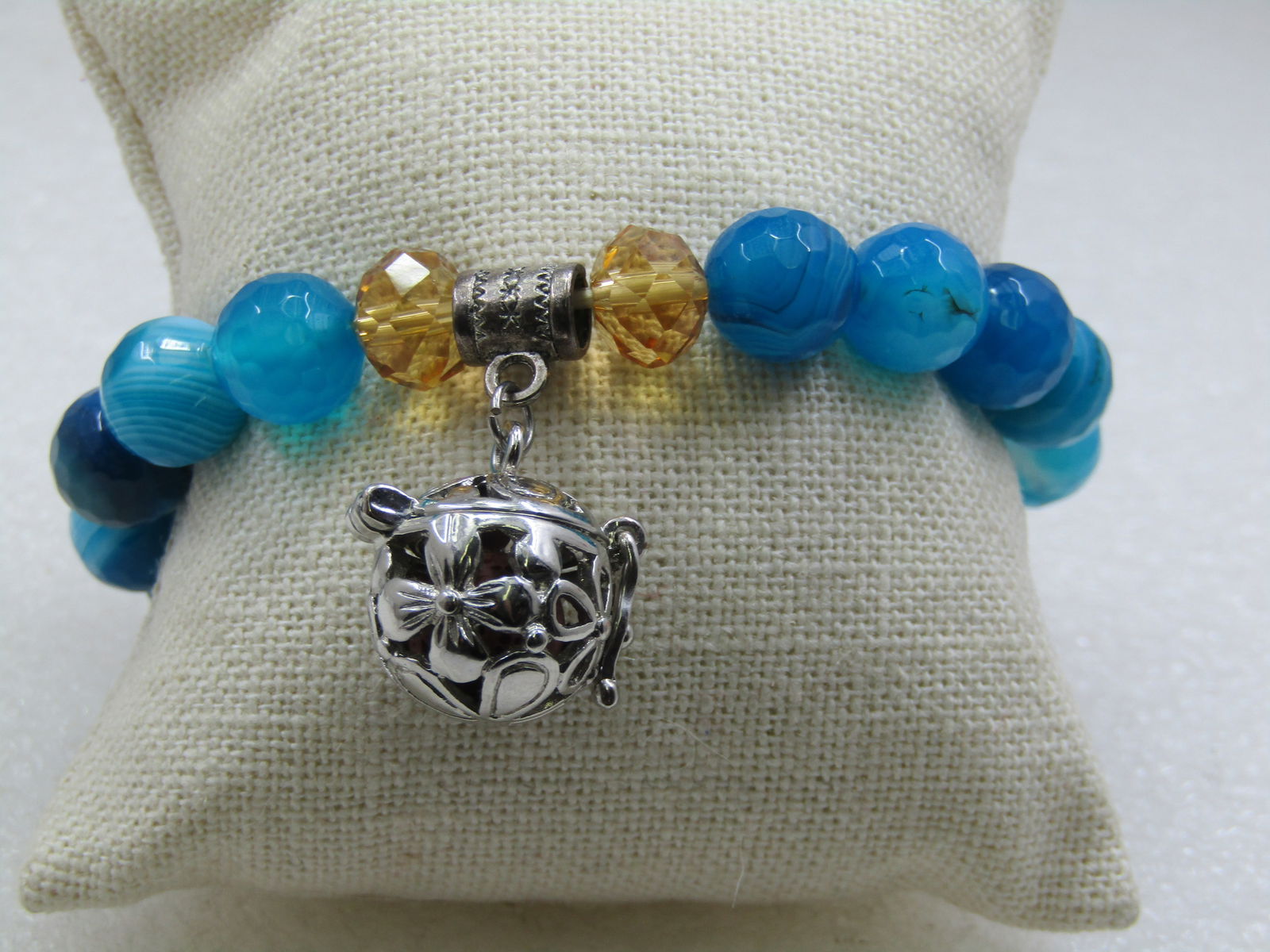 Vintage Faux Tuquoise Coiled Bracelet, Adjustable 6-8", 1960's-1970's: Vintage Faux Tuquoise Coiled Bracelet, Adjustable 6-8", 1960's-1970's. It is gold tone and the band is appx. 7mm wide with the look of an omega link but it is not true omega but a ridged design with r