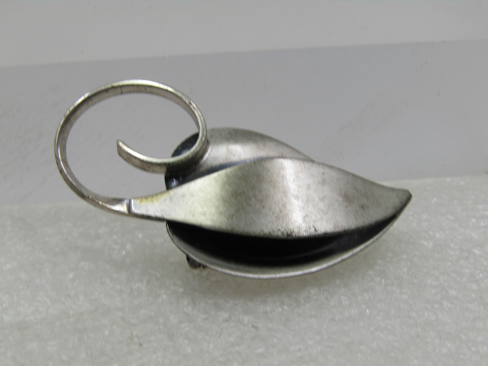 Vintage Sterling Jewelart Leaf Brooch, Mid-Century, 2": Vintage Sterling Jewelart Leaf Brooch, Mid-Century, 2" by 1" with curved stem with brushed and smooth finish. Tiered mid-century mod design. Weight of the brooch is appx. 7.38 grams. Some light wear,