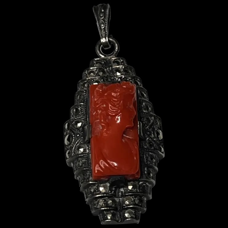 Vintage Carved Coral Cameo and Marcasite Pendant: Title: Vintage Carved Coral Cameo and Marcasite Pendant Description: Vintage Carved Coral Cameo and Marcasite Pendant1 x .5 InchesWeight - 3.7 Grams Date/Period: vintage Materials: Coral/Marcasite Siz