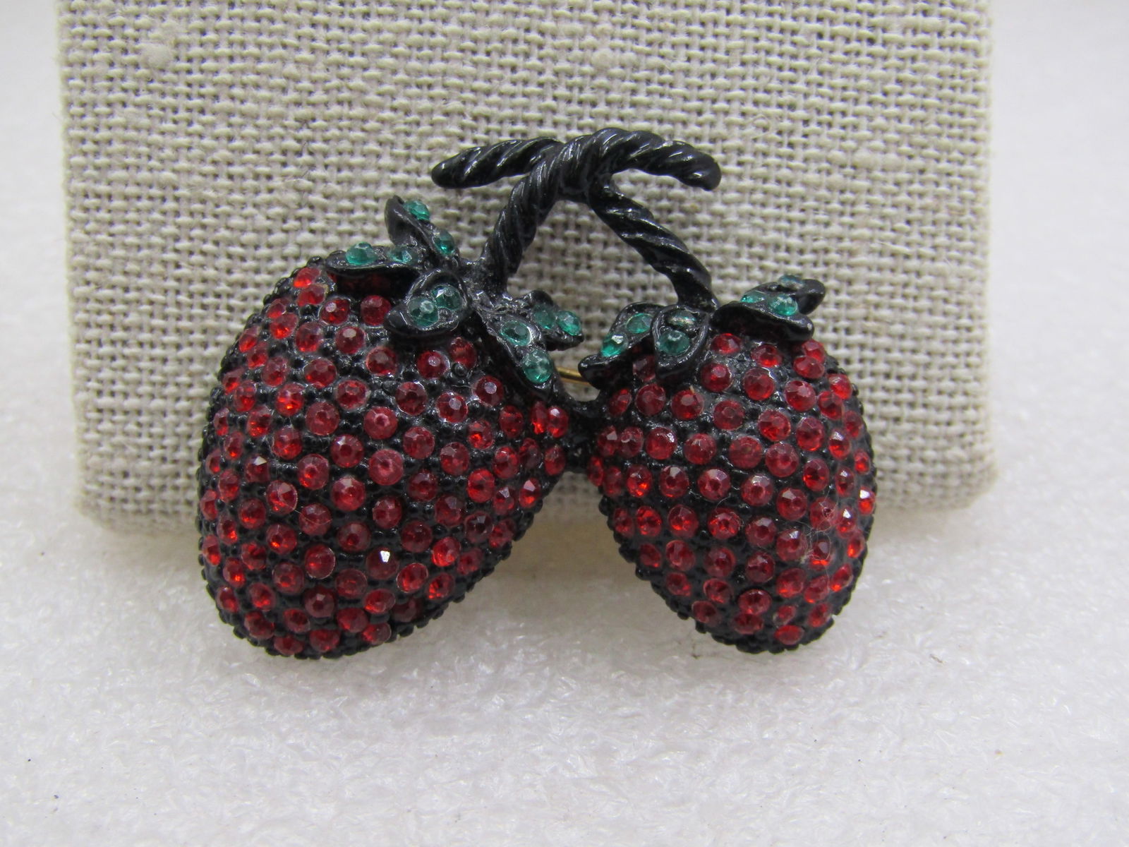Vintage Red & Green Rhinestone Strawberries Brooch, Black Metal, Mid-Century Weiss: Vintage Red & Green Rhinestone Strawberries Brooch, Black Metal, Mid-Century, Weiss unsigned.1.5" tall and wide. Black metal mounting and stems. Not signed by them aker. Very good condition. (W51422.3
