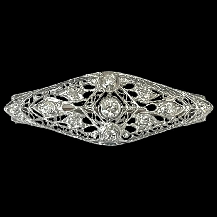 Art Deco 14k Gold Filigree Diamond Brooch: Title: Art Deco 14k Gold Filigree Diamond Brooch Description: Art Deco 14k Gold Filigree Diamond BroochHallmarked: 14k White Gold with a 14k Yellow Gold ClosureApprox. 1 carat total weight (11 Diamond