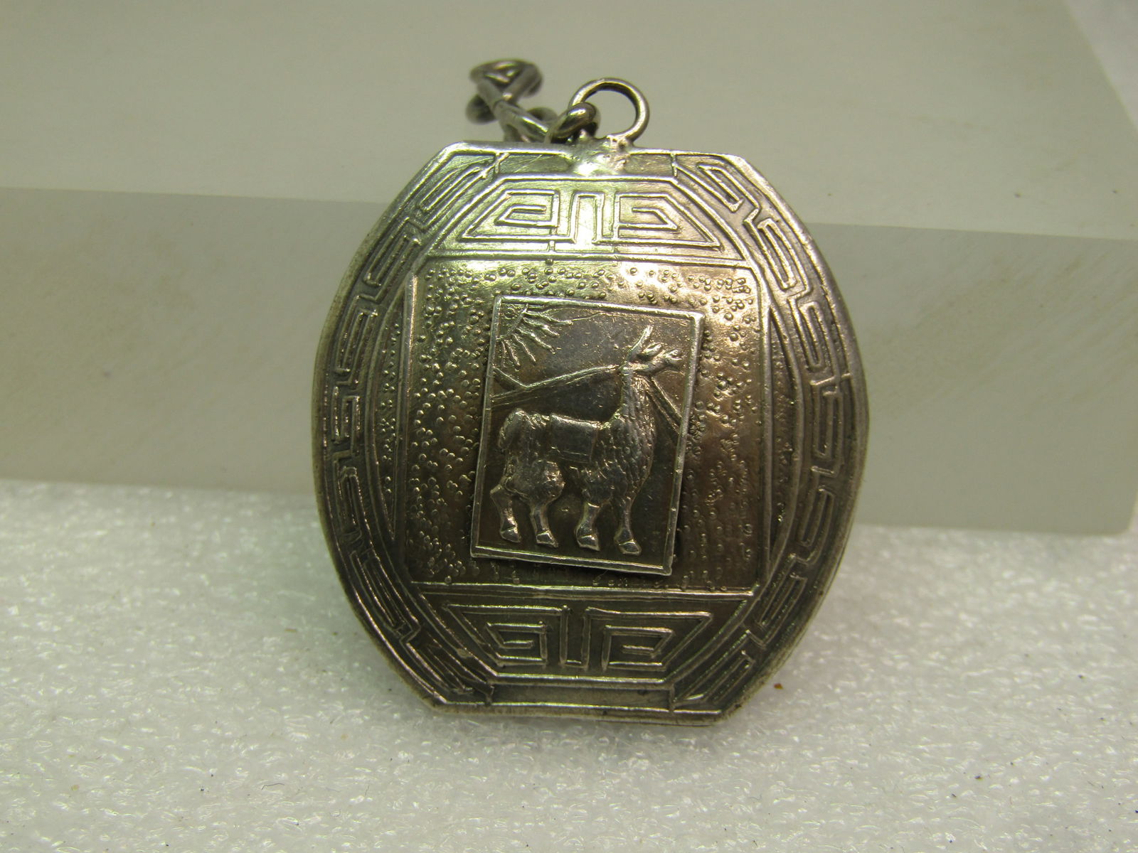 Vintage Sterling Peruvian Pendant, 1960's-1970's, Two-Sided: Vintage Sterling Peruvian Pendant, 1960's-1970's, Two-Sided with a Peruvian male with headdress and a llama on the opposite side. Puffy pendant with textured and taised designs. The pendant is appx. 1