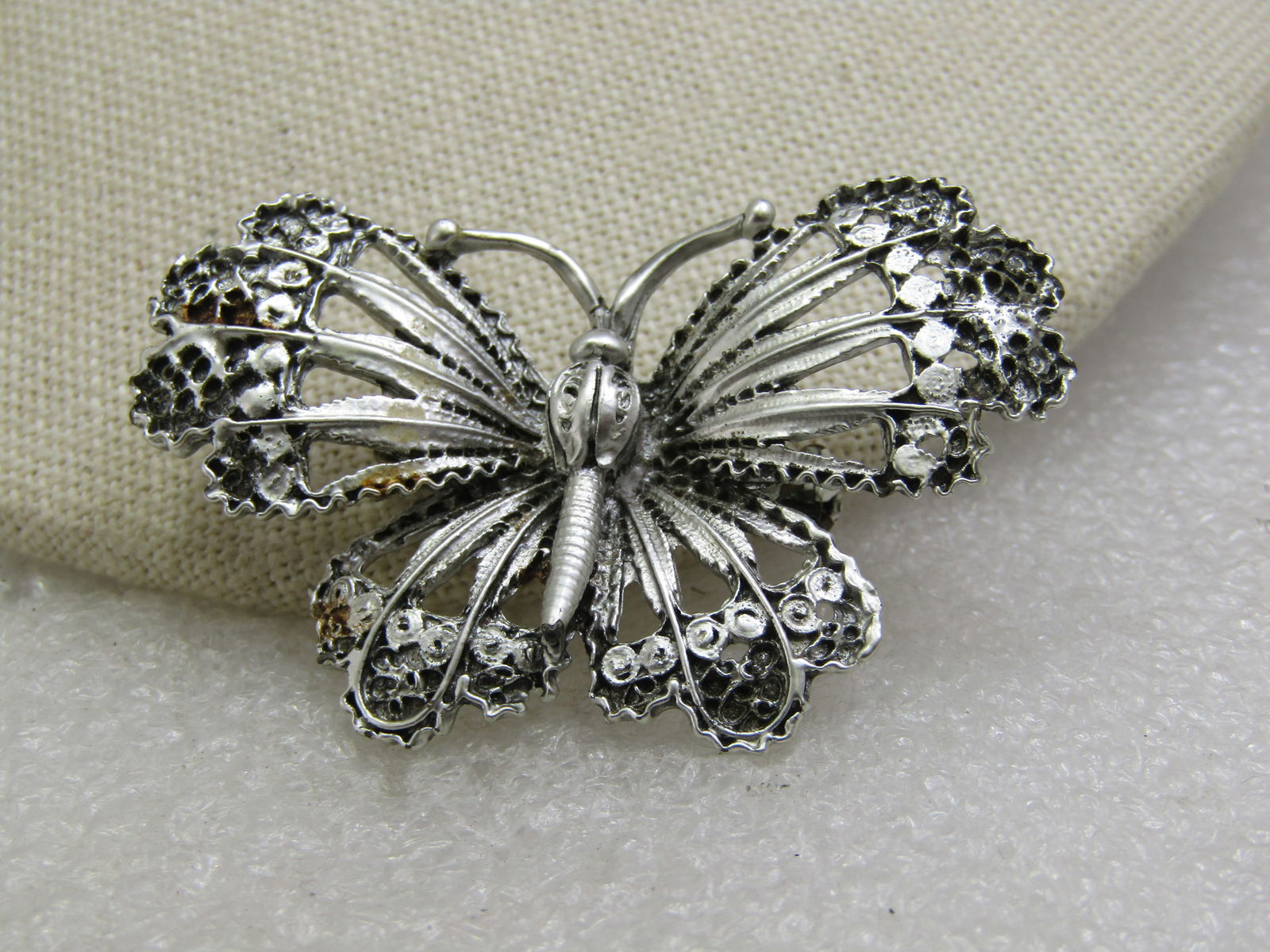 Vintage Silver Enameled Moth/Butterfly Brooch, 2": Vintage Silver Enameled Moth/Butterfly Brooch, 2" wide and 1.25" tall with open work in the winds and a lacy scalloped look on the tips Very good conidtion. Age is appx. 1950's-1960's. Not signed
