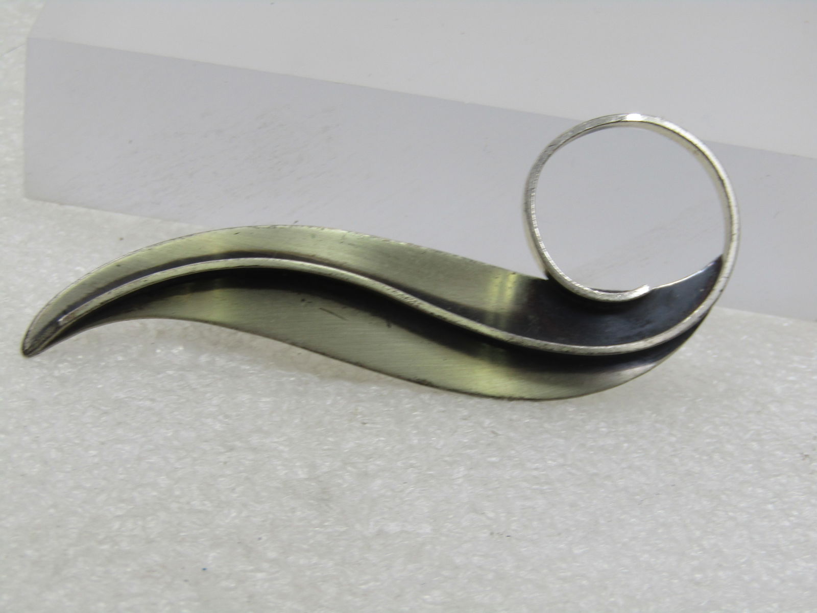 Vintage Beau Sterling Long Mod Leaf Brooch, Mid-Century, 3.25": Vintage Beau Sterling Long Mod Leaf Brooch, Mid-Century, 3.25" long and 1.25" at coil. this is a brushed and burnished finish that is curved and down the center is a silver vein that is appx. 1.5mm th