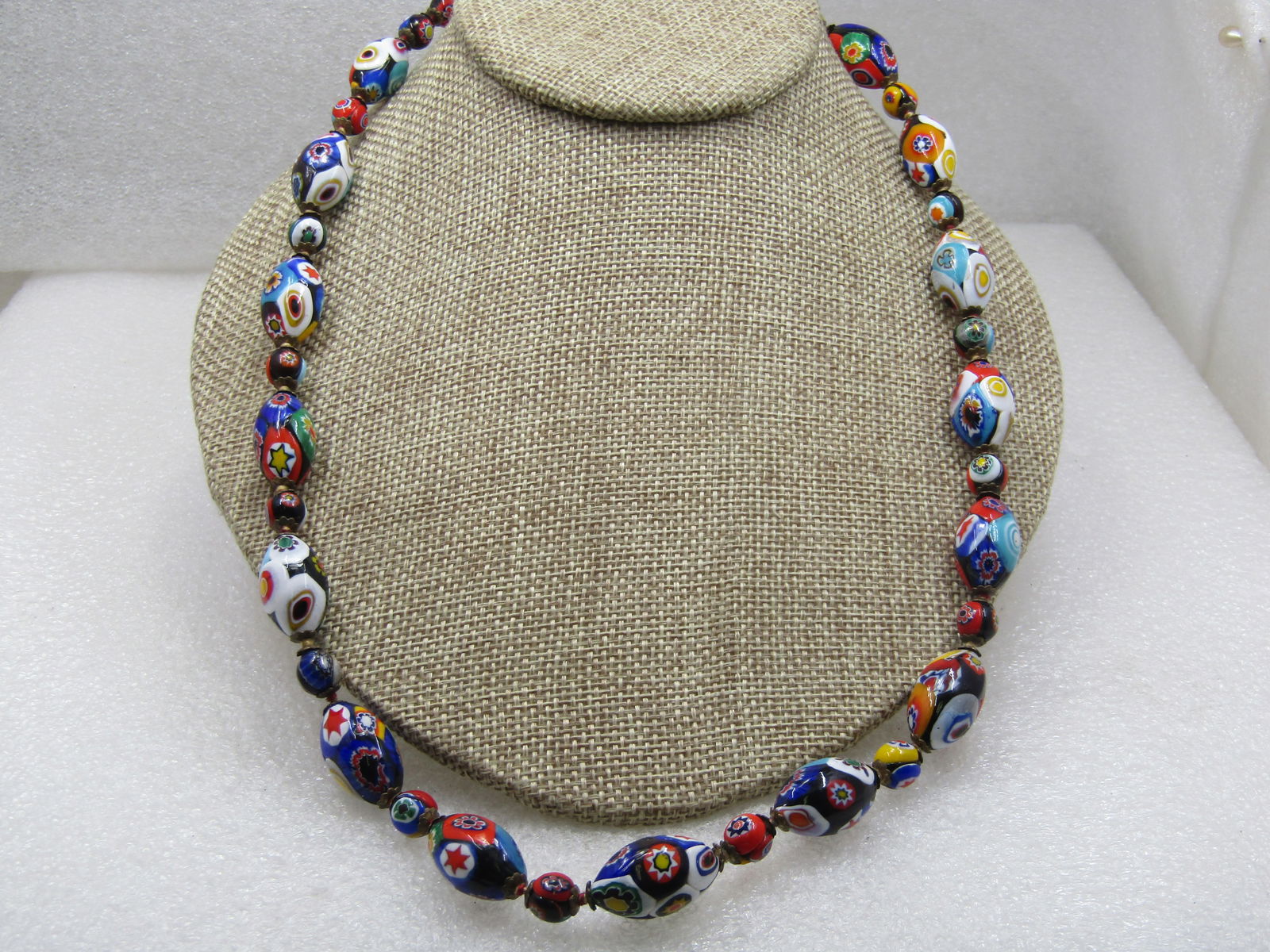 Vintage Venetian Millefiori Beaded Necklace, 22", Mid-Century: Vintage Venetian Millefiori Beaded Necklace, 22", Mid-Century with a newer clasp. This is made with chunky oval beads and smaller round beads each with many flowrs or designs. The glass beads are appx
