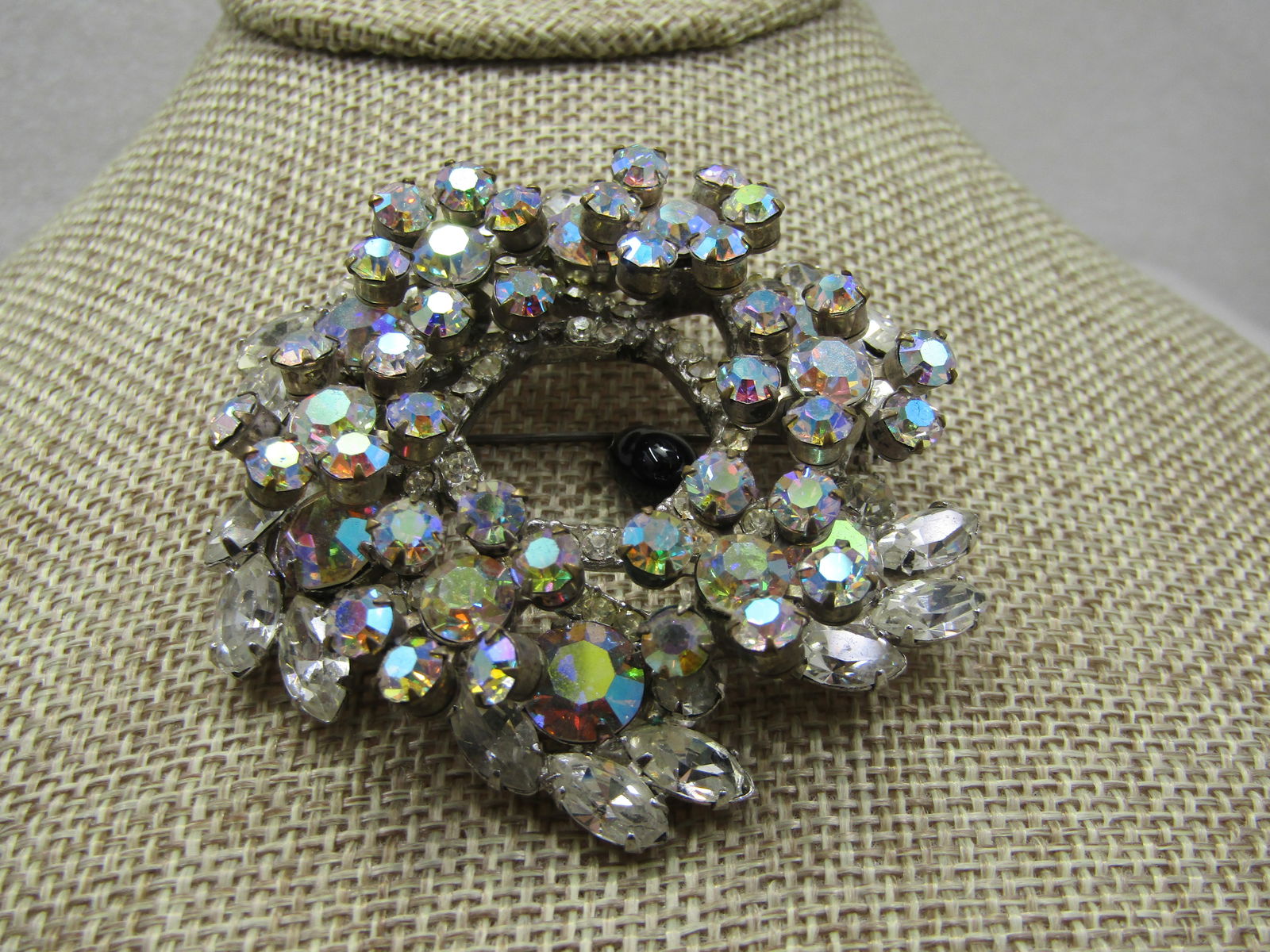 Vintage Rhinestone Tiered Statement Brooch, 2.5", 1940's: Vintage Rhinestone Tiered Statement Brooch, 2.5", 1940's. This is a tiered brooch with both clear rhinestones and aurora borealis rhinestones. Silver tone with the lower level on the outer edge having