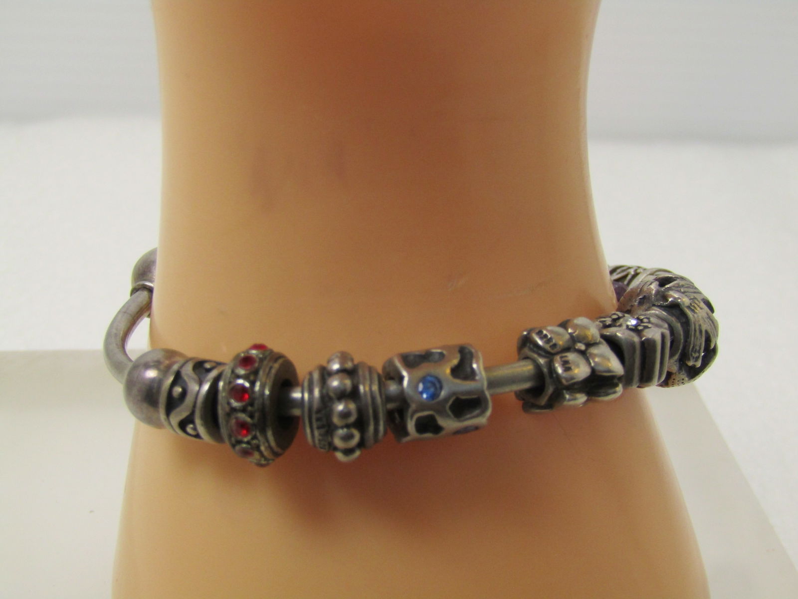 Vintage Sterling Cham Signed Slide Cuff Bracelet, Pandora, Cham, LLA Charms, 7", 1990's: Vintage Sterling Cham Signed Slide Cuff Bracelet, Pandora, Cham, LLA Charms, 7", 1990's. There are twelve sliding charms, five are signed with Pandora's ALE mark, three are signed with LAA, and 