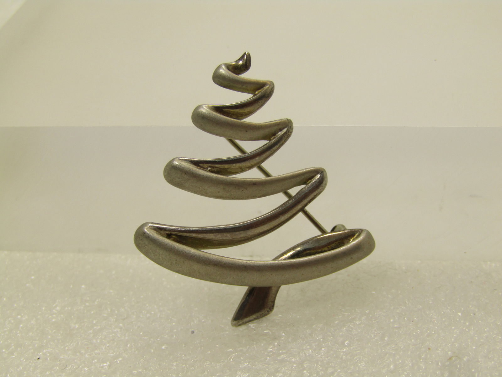 Vintage Sterling Zig Zag Tree Brooch, Signed B.A.B., 1980's: Vintage Sterling Zig ZagTree Brooch, Signed B.A.B., 1980's. (BAB is Ba Ballou). This is a scribble style Christmas tree or just tree. It has alternating smooth lines with satiny lines that are silghtl