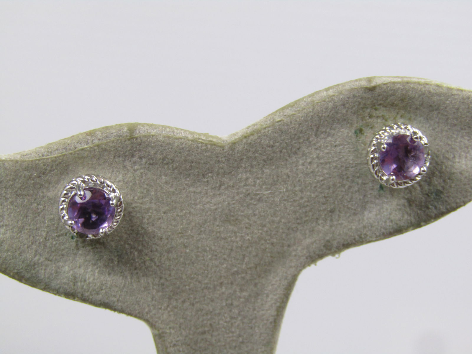 Sterling Amethyst Diamond Chip Earrings, Pierced, Signed, 1990's: Sterling Amethyst Diamond Chip Earrings, Pierced, Signed, 1990's or after. They have a round appx. 5.5mm amethyst prong-set in each earring. They are marked .925 and signed either D&J or DBJ. They
