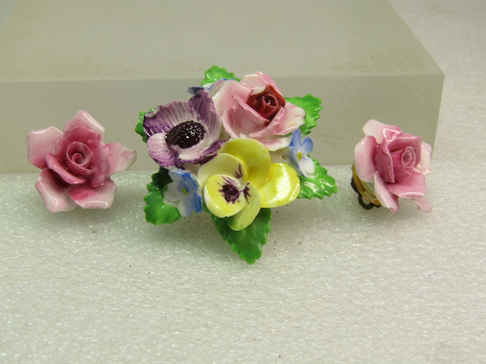 Vintage Porcelain Floral Brooch & Clip Earrings, 1960's-1970's, Signed Adderly, England: Vintage Porcelain Floral Brooch & Clip Earrings, 1960's-1970's, Signed Adderly, England. The brooch has a yellow pany, blue forget-me nots- a pink rose and a purple flower with six green leaves. The b
