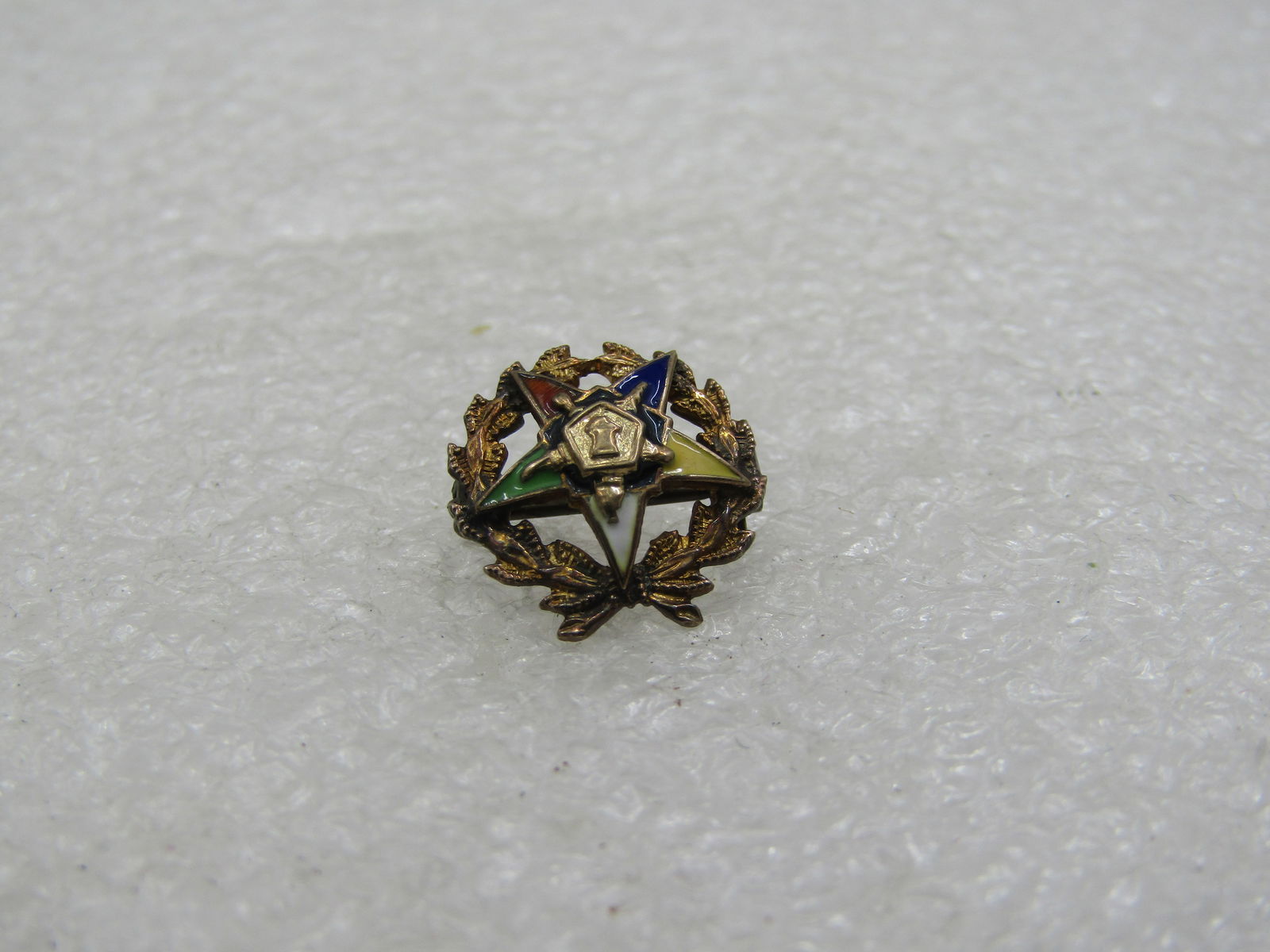 Vintage 10kt Top Masonic Eastern Star Brooch, Enameled, 1/2": Vintage 10kt Top Masonic Eastern Star Brooch, Enameled, 1/2". Slightly domed with the Eastern Star colors and open star design. Marked 10kt Top (total weight is appx. 95 gr). signed with a diamond sha