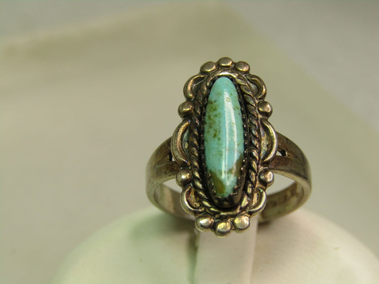 Vintage Sterling Southwestern Turquoise Ring, Sz. 6, Bell Trading, 1960's-1970's: Vintage Sterling Southwestern Turquoise Ring, Sz. 6, Bell Trading, 1960's-1970's. This is marked sterling and tests as sterling with an appx. weight of 3.93 grams. It has an elongaged turquoise caboch