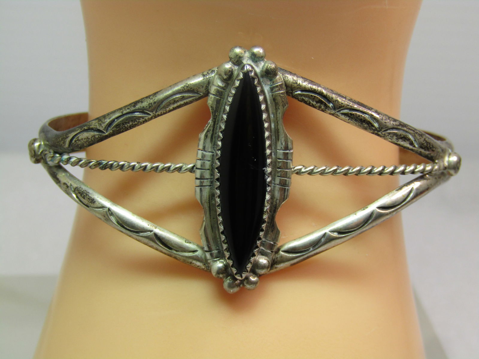 Vintage Sterling Southwestern/Navajo Onyx Cuff Bracelet, 6.5", 1970's-1980's, Signed: Vintage Sterling Southwestern/Navajo Onyx Cuff Bracelet, 6.5", 1970's-1980's, Signed. The onyx is long and pointed and appx. 30mm doing down the wrist and 8mm across with sawtooth bezel-setting sitton